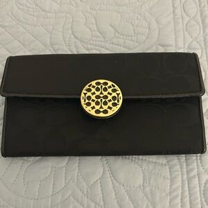 EUC Coach wallet. Black with gold tone hardware.